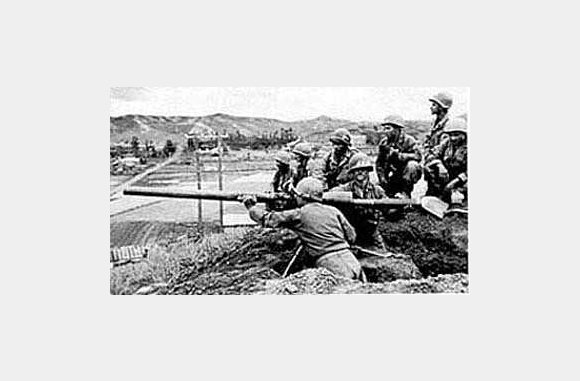 Rifle crew of M Company, 3rd Battalion, with a 75mm recoilless rifle, guarding a valley north of Chorwan, June 15, 1951.  U.S. ARMY PHOTO