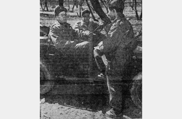 CHAPLAIN ROTT (below) chats with Pvt. Felix S. Marinda, of Ponce, P.R., before holding Sunday services. The chaplain's driver is PFC Osvaldo S. Flores, of Luzon P.R.