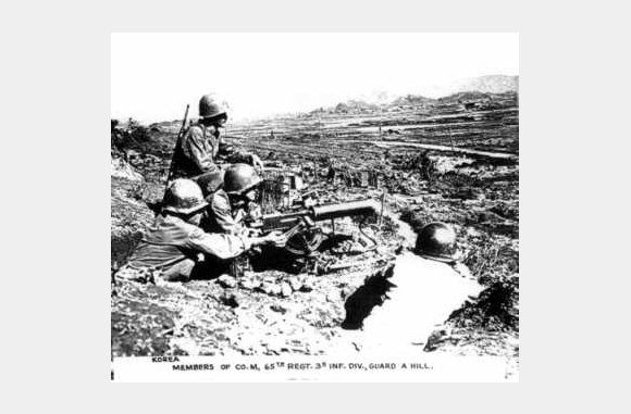 Members of the 65th Infantry Regiment, 3rd Division, Company M, guard a hill. - Korea