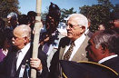 Mr. Cordero (L),  Mr. Carlos Romero-Barcelo around the tree dedicated at Arlington sing the 65th Regimental Song along with all the 65th Veterans.