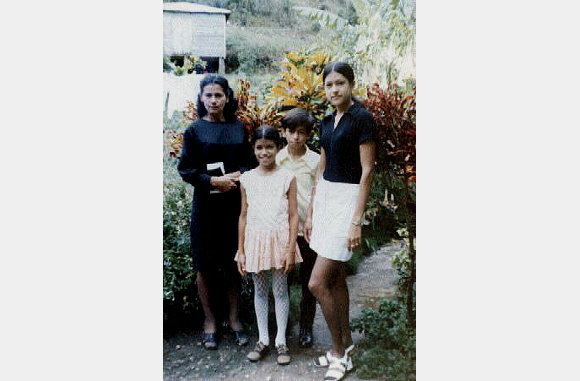 My aunt Aida Nieves and three of her children. Rosita, Jose Miguel, and Olga